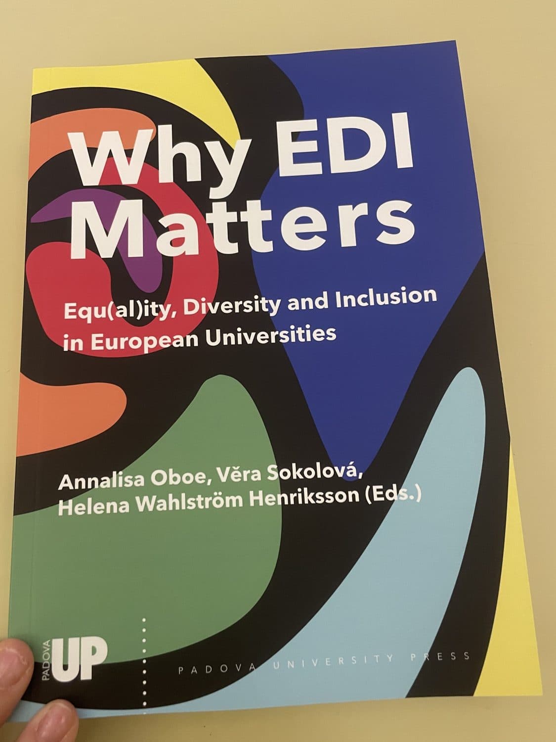 The book Why EDI Matters: Equ(al)ity, Diversity and Inclusion in European Universities, published by Padova University Press, held in one hand.